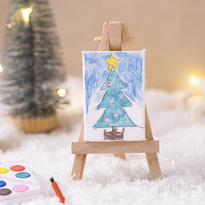 Tonttu esittää taiteilijaa